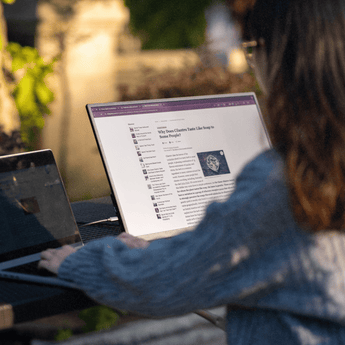 Woman using Eazeye Monitor 2.0 outdoors, highlighting RLCD qualities with glare-free, paper-like display that adapts seamlessly to natural light.