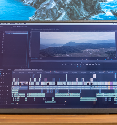 Eazeye Monitor 2.0 used indoors to edit a video on Premiere Pro, highlighting its crisp display and anti-glare features for detailed work.