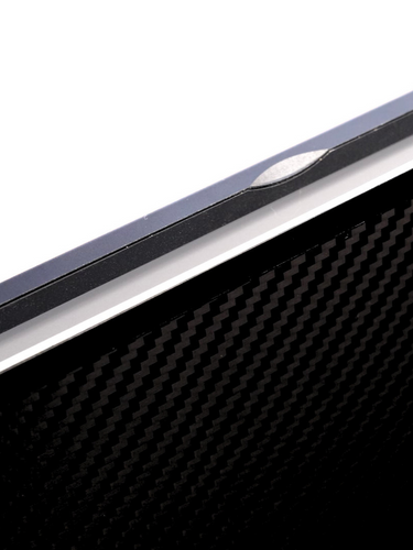 Close-up of Eazeye Monitor 1 back panel showing carbon-fiber texture and open lid