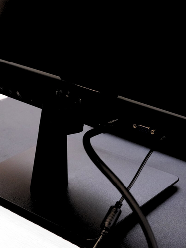 Close-up of Eazeye Monitor 1 backside ports while on desk, showing connectivity