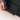 Close-up of woman setting up Eazeye Monitor 2 kickstand on white desk