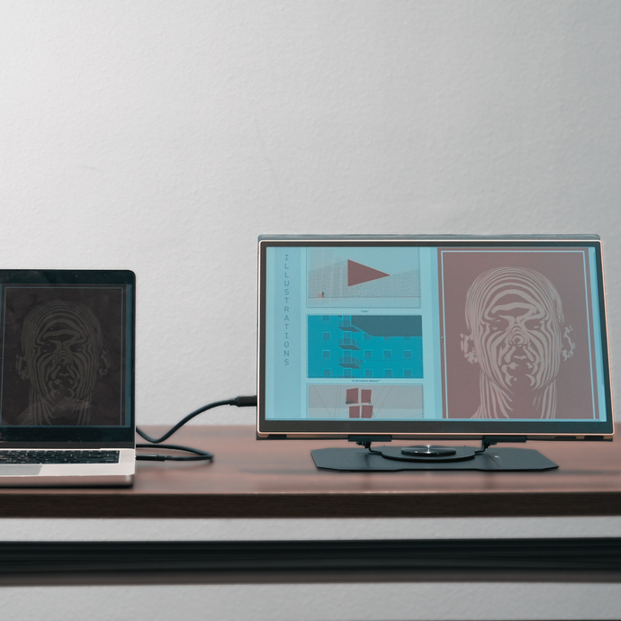 Radiant monitor displaying illustrations while mirroring a laptop screen, portable transflective display