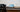 Radiant monitor on desk connected to laptop, mirroring screen with transflective LCD