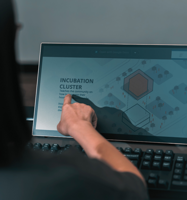 User casting a shadow on Radiant monitor to show paper-like reactivity to light