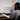 Woman using Eazeye Monitor 2 on desk indoors to work on a project