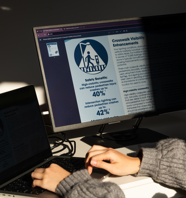 Woman using Eazeye Monitor 2 indoors showing paper-like reflective LCD qualities