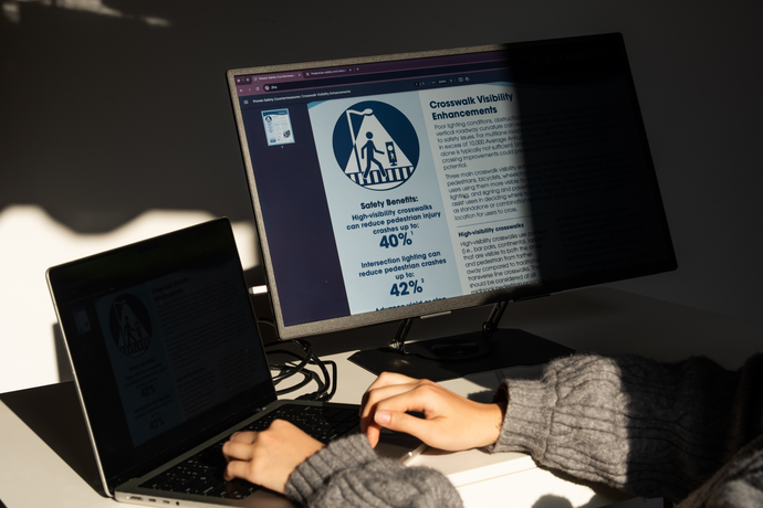 Woman using Eazeye Monitor 2 indoors showing paper-like reflective LCD qualities