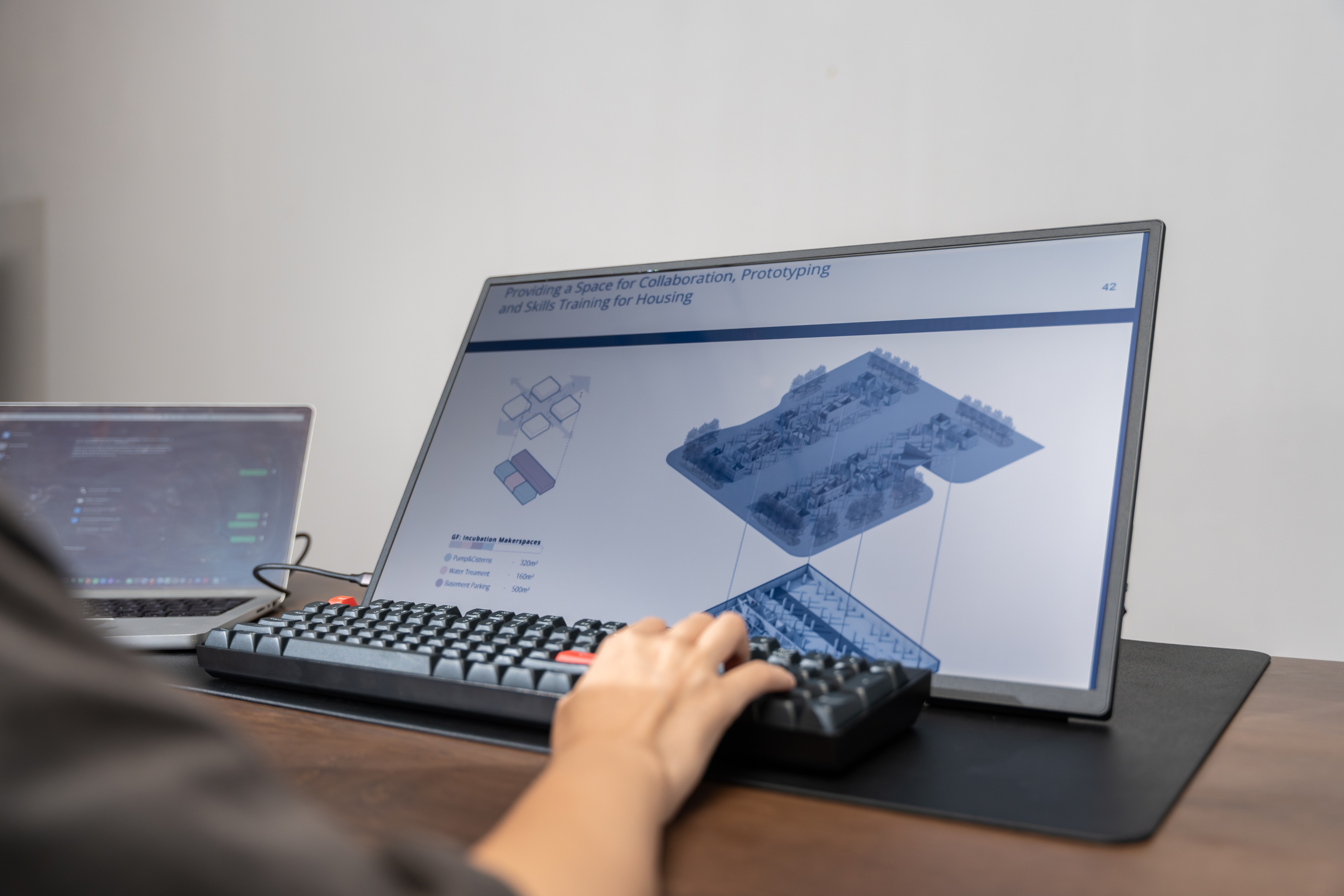 Woman working with Eazeye Monitor 2 in an office, reflective RLCD workspace display