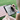 Woman sketching outdoors on Paper 2, RLCD screen with paper-like qualities